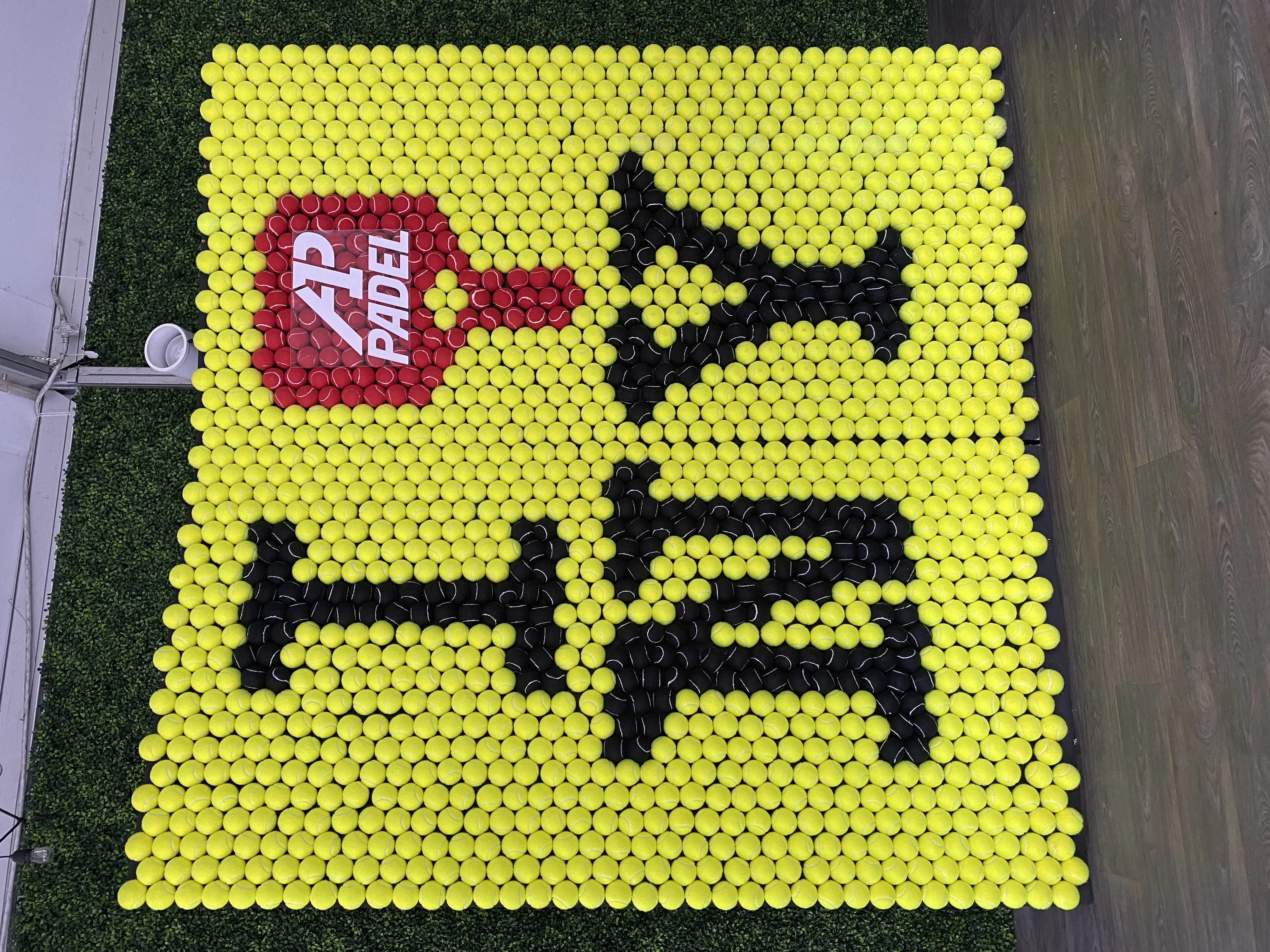 A1 Padel taxi photo installation made with tennis balls